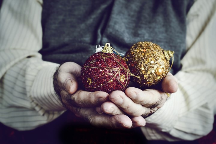 Man holding baubles