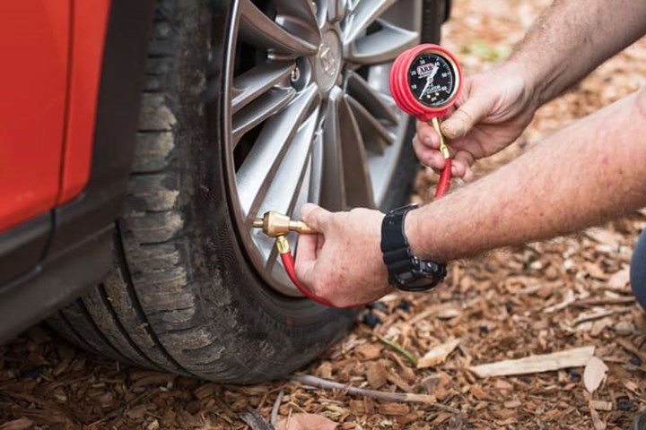 man inflating tires