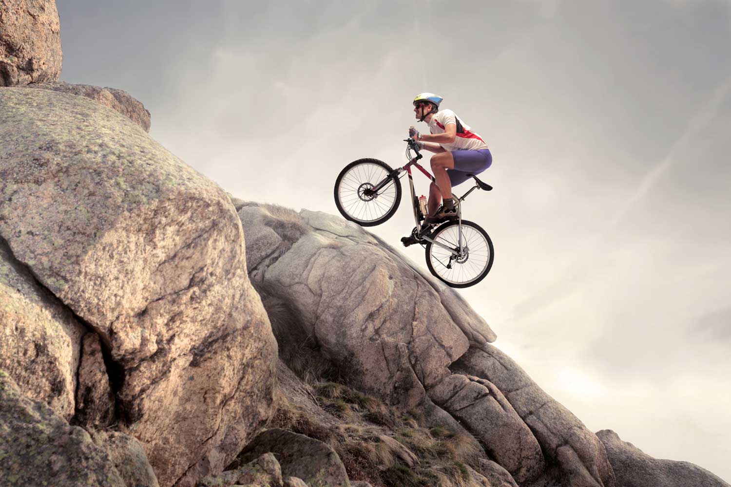 Man cycling up mountain