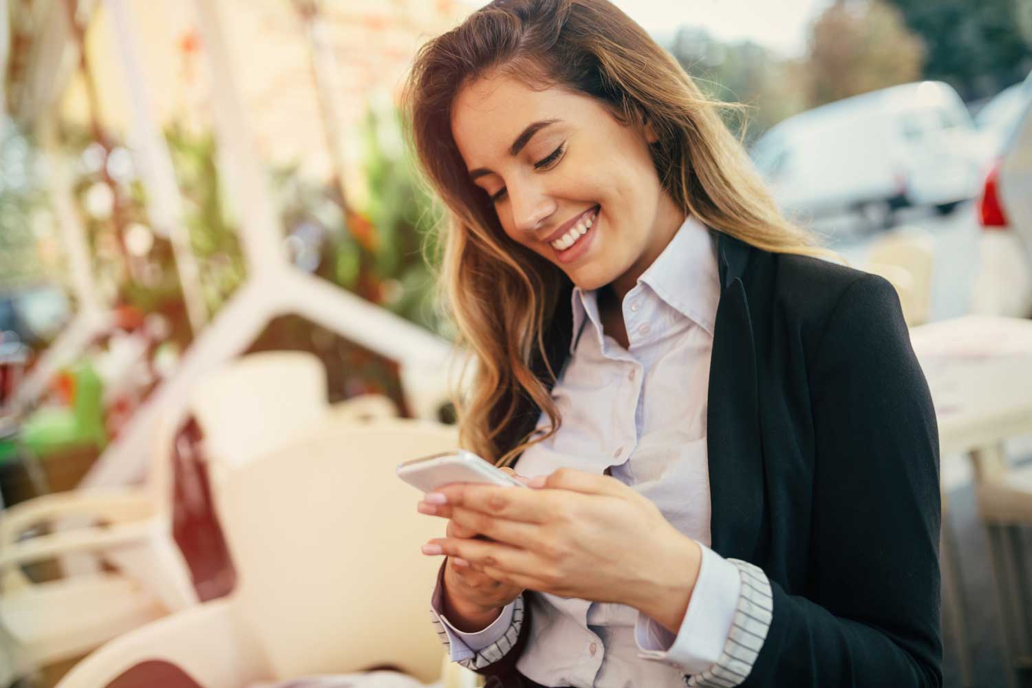 woman smiling at phone